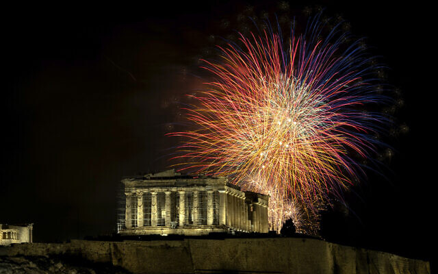 Fireworks explode over the ancient Parthenon temple at the Acropolis hill during New Year's celebrations in Athens, Greece, Monday, Jan. 1, 2024. (AP Photo/Yorgos Karahalis) Fireworks explode over the ancient Parthenon temple at the Acropolis hill during New Year's celebrations in Athens, Greece, Monday, Jan. 1, 2024. (AP Photo/Yorgos Karahalis)