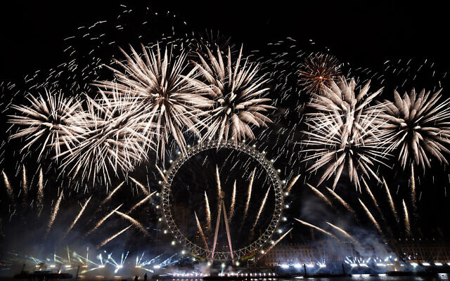 Fireworks light-up the sky over the London Eye in central London to celebrate the New Year on Monday, Jan. 1, 2024.(AP Photo/Alberto Pezzali) Fireworks light-up the sky over the London Eye in central London to celebrate the New Year on Monday, Jan. 1, 2024.(AP Photo/Alberto Pezzali)