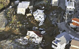 Houses fallen by an earthquake are seen in Kanazawa, Ishikawa prefecture, Japan, January 2, 2024. (Kyodo News via AP)