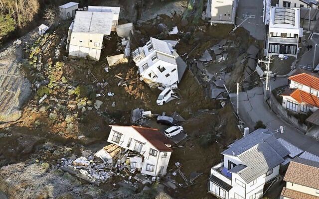 Houses fallen by an earthquake are seen in Kanazawa, Ishikawa prefecture, Japan, January 2, 2024. (Kyodo News via AP) Houses fallen by an earthquake are seen in Kanazawa, Ishikawa prefecture, Japan, January 2, 2024. (Kyodo News via AP)