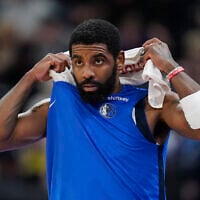 Dallas Mavericks guard Kyrie Irving comes off the bench during the first half of an NBA basketball game against the Utah Jazz, in Salt Lake City, January 1, 2024. (Rick Bowmer/AP)