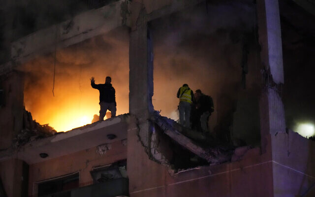 Civil defense workers search for survivors inside an apartment following a massive explosion in the southern suburb of Beirut, Lebanon, on Tuesday, January 2, 2024. Hezbollah-linked media said top Hamas official Saleh Arouri was killed Tuesday in an explosion in a southern Beirut suburb.(AP Photo/Hussein Malla) Civil defense workers search for survivors inside an apartment following a massive explosion in the southern suburb of Beirut, Lebanon, on Tuesday, January 2, 2024. Hezbollah-linked media said top Hamas official Saleh Arouri was killed Tuesday in an explosion in a southern Beirut suburb.(AP Photo/Hussein Malla)
