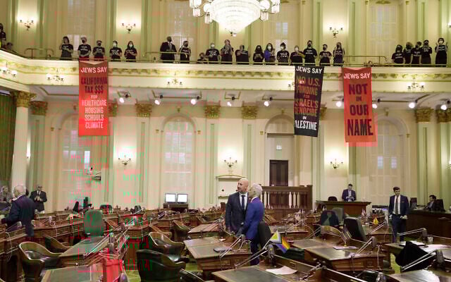 Assembly members Heath Flora, left, and Josh Lowenthal, right, leave the Assembly chambers as pro-Palestinian, anti-Israel protesters calling for a ceasefire in Gaza disrupt the first day of the California legislative session in Sacramento, California, January 3, 2024. (Rich Pedroncelli/AP) Assembly members Heath Flora, left, and Josh Lowenthal, right, leave the Assembly chambers as pro-Palestinian, anti-Israel protesters calling for a ceasefire in Gaza disrupt the first day of the California legislative session in Sacramento, California, January 3, 2024. (Rich Pedroncelli/AP)