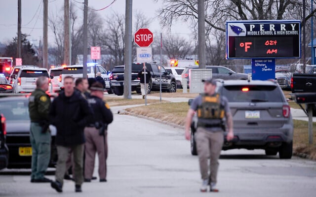 Police respond to Perry High School in Perry, Iowa., Thursday, Jan. 4, 2024. (AP Photo/Andrew Harnik)