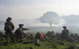 Israeli combat reservists and tank forces take part in training drills on the Lebanese front in the Golan Heights, Jan. 4, 2024. (AP Photo/Ohad Zwigenberg)