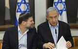 File: Prime Minister Benjamin Netanyahu, right, speaks with Finance Minister Bezalel Smotrich during the weekly cabinet meeting at the Defense Ministry in Tel Aviv, January 7, 2024. (Ronen Zvulun/Pool via AP)