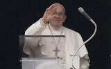 Pope Francis delivers his blessing as he recites the Angelus noon prayer from the window of his studio overlooking St.Peter's Square, at the Vatican, January 7, 2024. (Andrew Medichini/AP)