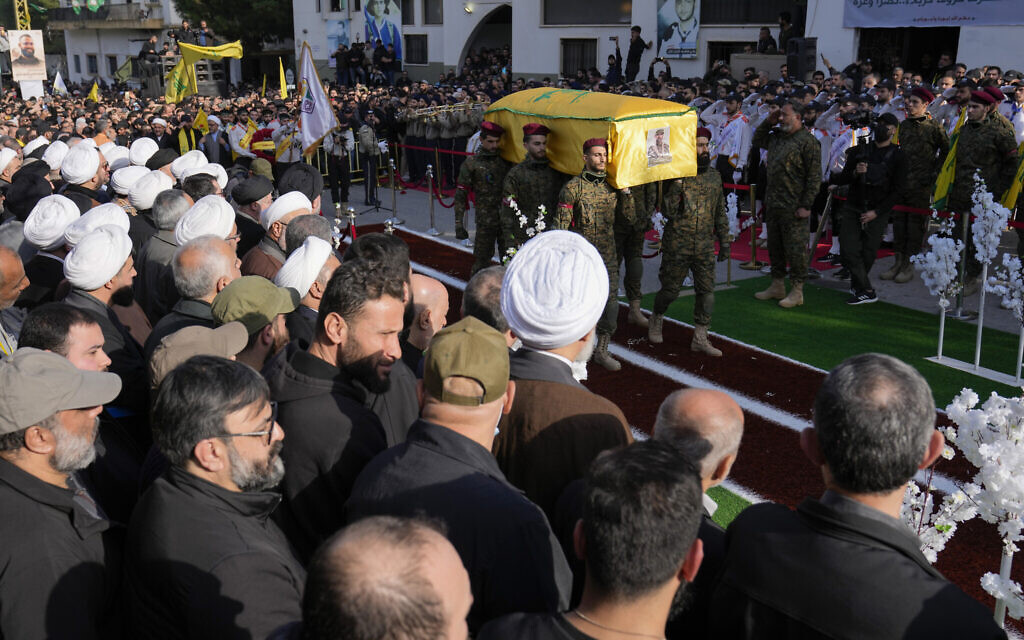 Hezbollah members carry the coffin of senior Hezbollah commander Wissam Tawil, during his funeral procession in the village of Khirbet Selm, south Lebanon, January 9, 2024. (AP Photo/Hussein Malla)