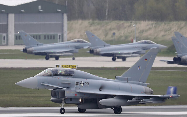 A Eurofighter from the German Air Force Weapons School takes off for an exercise in Large, Germany, April 30, 2021. (Bernd Wuestneck/dpa via AP, File) A Eurofighter from the German Air Force Weapons School takes off for an exercise in Large, Germany, April 30, 2021. (Bernd Wuestneck/dpa via AP, File)