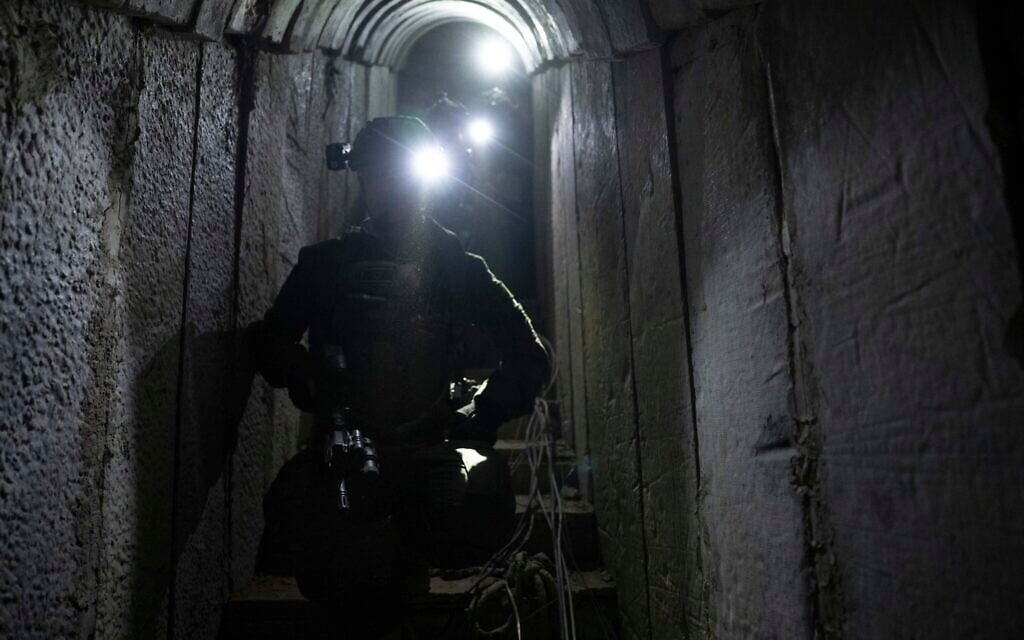 Israeli soldiers show journalists an underground tunnel where the IDF said it had found evidence hostages were held by terrorists in Khan Younis, Gaza Strip, on January 10. 2024. (AP Photo/Ohad Zwigenberg)