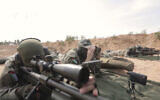 This image from a video posted by Hamas on December 20, 2023, purports to show Hamas terrorists using domestic copies of the AM-50 Sayyad, an Iranian-made a sniper rifle that fires a .50- caliber round powerful enough to punch through up to an inch of steel. (Hamas via AP)