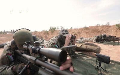 This image from a video posted by Hamas on December 20, 2023, purports to show Hamas terrorists using domestic copies of the AM-50 Sayyad, an Iranian-made a sniper rifle that fires a .50- caliber round powerful enough to punch through up to an inch of steel. (Hamas via AP)