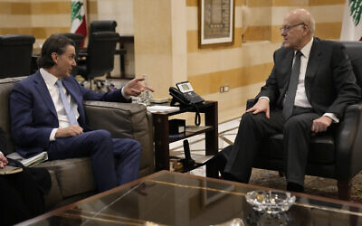 Senior US envoy Amos Hochstein, left, gestures as he meets with Lebanese caretaker Prime Minister Najib Mikati, in Beirut, Lebanon, January 11, 2024. (AP Photo/Hussein Malla)