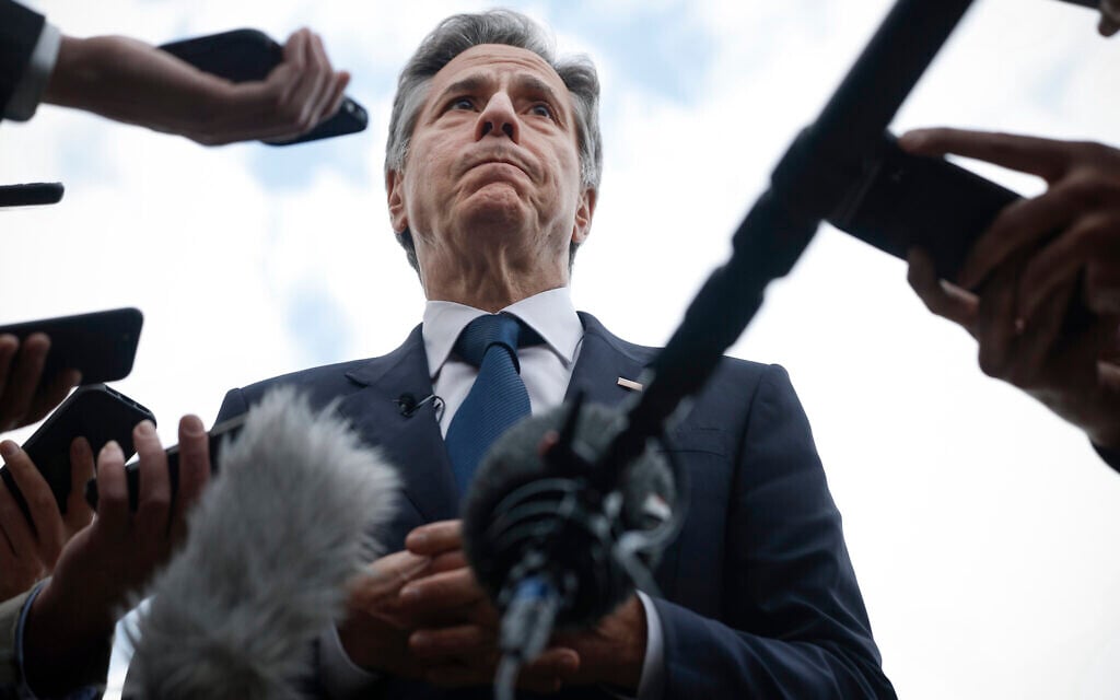 US Secretary of State Antony Blinken speaks to members of the media before boarding his plane to return to Washington, following his week-long trip aimed at calming tensions across the Middle East, in Cairo, Egypt, January 11, 2024. (Evelyn Hockstein/Pool via AP)