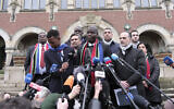 South Africa's Minister of Justice and Correctional Services Ronald Lamola, center, and Palestinian Assistant Minister of Multilateral Affairs Ammar Hijazi, third right, address the media outside the International Court of Justice in The Hague, Netherlands, January 11, 2024. (AP/Patrick Post)