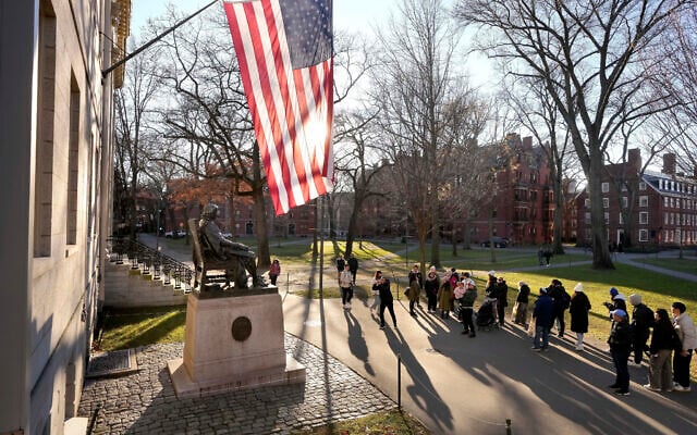 People take photos near a John Harvard statue, left, on the Harvard University campus, Tuesday, Jan. 2, 2024, in Cambridge, Massachusetts. (AP Photo/Steven Senne, File) People take photos near a John Harvard statue, left, on the Harvard University campus, Tuesday, Jan. 2, 2024, in Cambridge, Massachusetts. (AP Photo/Steven Senne, File)