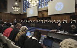 Judges and parties sit during a hearing at the International Court of Justice in The Hague, Netherlands, January 12, 2024. (AP Photo/Patrick Post)