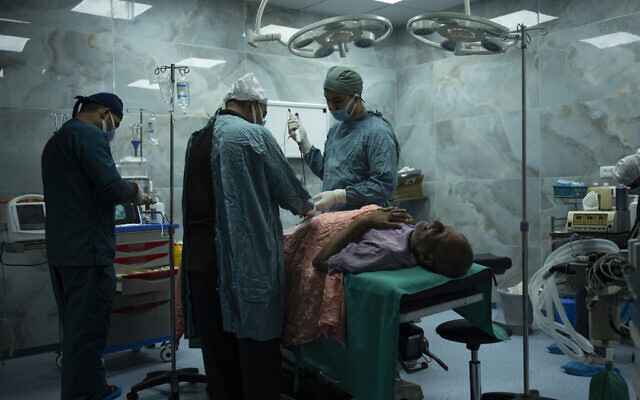 Dr. Suhaib Alhamss, the director of the Kuwaiti Hospital in Gaza's southern city of Rafah, performs surgery on a patient, January 11, 2024. (AP Photo/Fatima Shbair) Dr. Suhaib Alhamss, the director of the Kuwaiti Hospital in Gaza's southern city of Rafah, performs surgery on a patient, January 11, 2024. (AP Photo/Fatima Shbair)