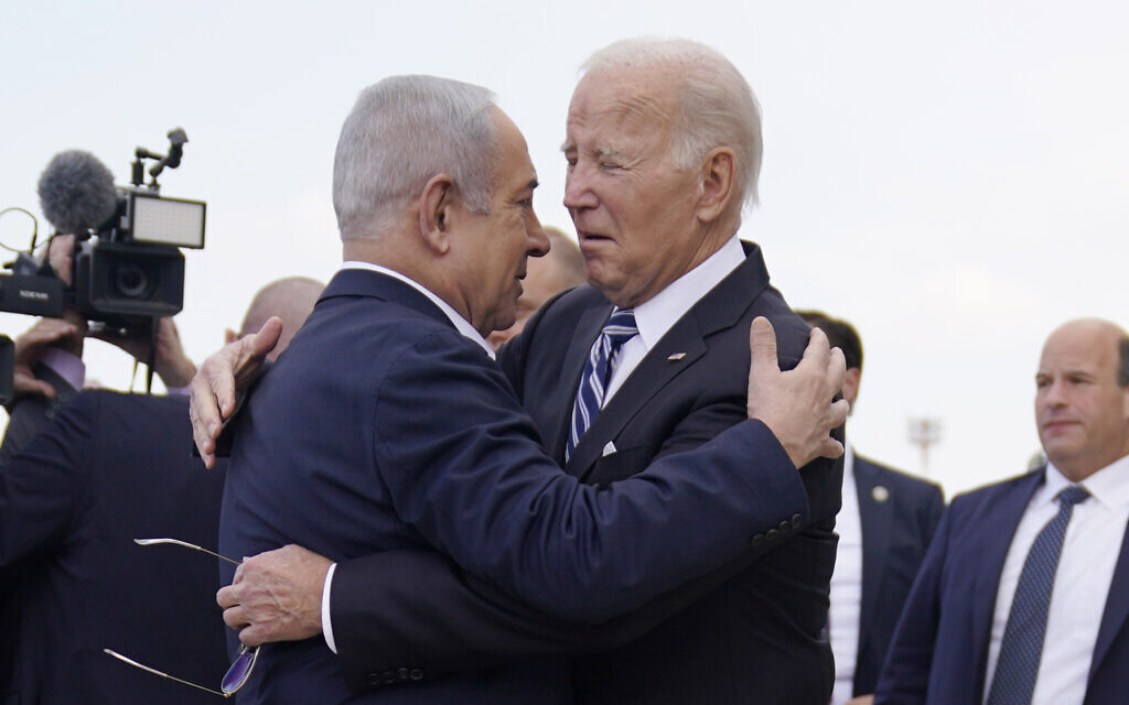 US President Joe Biden is greeted by Prime Minister Benjamin Netanyahu (right) after arriving at Ben Gurion International Airport, on October 18, 2023, in Tel Aviv. (AP/Evan Vucci) US President Joe Biden is greeted by Prime Minister Benjamin Netanyahu (right) after arriving at Ben Gurion International Airport, on October 18, 2023, in Tel Aviv. (AP/Evan Vucci)