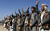 Houthi fighters and tribesmen stage a rally against the US and the U.K. strikes on Houthi-run military sites near Sanaa, Yemen, on January 14, 2024. (AP Photo)