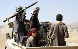 Fighters from the Iran-backed Houthi rebels stage a rally against the US and the UK strikes on Houthi-run military sites near Sanaa, Yemen, on January 14, 2024. (AP Photo)