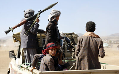 Fighters from the Iran-backed Houthi rebels stage a rally against the US and the UK strikes on Houthi-run military sites near Sanaa, Yemen, on January 14, 2024. (AP Photo)