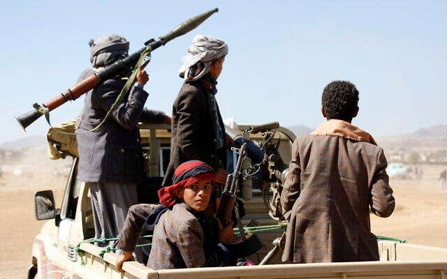 Fighters from the Iran-backed Houthi rebels stage a rally against the US and the UK strikes on Houthi-run military sites near Sanaa, Yemen, on January 14, 2024. (AP Photo) Fighters from the Iran-backed Houthi rebels stage a rally against the US and the UK strikes on Houthi-run military sites near Sanaa, Yemen, on January 14, 2024. (AP Photo)