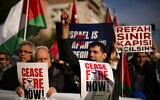 People shout slogans as they march in support of Palestinians during a protest calling for an immediate ceasefire in Gaza, in Istanbul, Turkey, January 14, 2024. (Emrah Gurel/AP)
