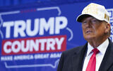 Republican presidential candidate former US president Donald Trump arrives to speak at a rally at Simpson College in Indianola, Iowa, January 14, 2024. (AP Photo/Andrew Harnik)