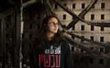 Sharon Alony Cunio weeps as she poses for a portrait in the ruins of her home in Kibbutz Nir Oz, January 15, 2024, from where she and her family were kidnapped by Hamas terrorists during the Oct. 7 massacres. (AP Photo/Maya Alleruzzo)