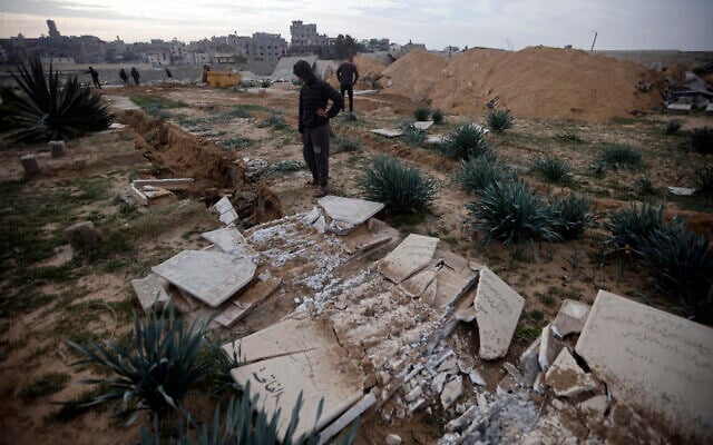 Palestinians inspect damaged graves following an Israeli raid over a cemetery in the Khan Younis refugee camp, southern Gaza Strip on Jan. 17, 2024. (AP Photo/Mohammed Dahman) Palestinians inspect damaged graves following an Israeli raid over a cemetery in the Khan Younis refugee camp, southern Gaza Strip on Jan. 17, 2024. (AP Photo/Mohammed Dahman)