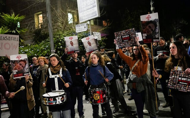 Relatives and supporters of the Israeli hostages held in the Gaza Strip by the Hamas terror group attend a protest calling for their release outside Israeli Prime Minister Benjamin Netanyahu's residence, in Jerusalem, Sunday, Jan. 21, 2024. (AP/Ohad Zwigenberg)