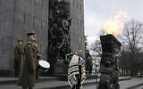 A rabbi says prayers on the eve of the 79th anniversary of the liberation of Auschwitz-Birkenau at the Monument to the Heroes of the Ghetto, in Warsaw, Poland, Jan. 26, 2024 (AP Photo/Czarek Sokolowski)