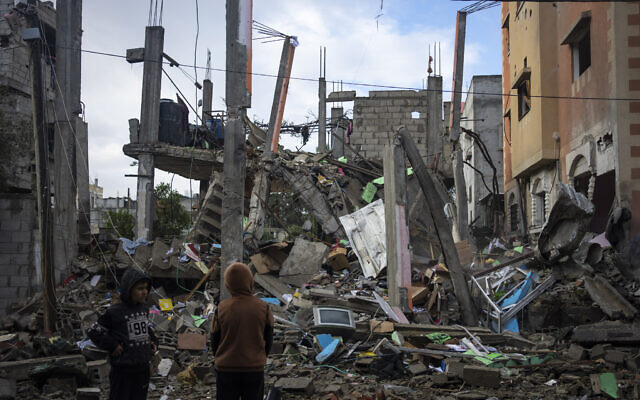 Palestinians look at the destruction after an apparent Israeli strike in Rafah, southern Gaza Strip, Saturday, Jan. 27, 2024. (AP Photo/Fatima Shbair) Palestinians look at the destruction after an apparent Israeli strike in Rafah, southern Gaza Strip, Saturday, Jan. 27, 2024. (AP Photo/Fatima Shbair)