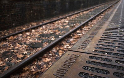 The name of the Nazi death camp Auschwitz photographed at 'Gleis 17', Track 17, the memorial site for the train transportation from Berlin to the camp, on International Holocaust Remembrance Day in Berlin, Jan. 27, 2024 (AP/Markus Schreiber)