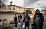 Turkish police officers stand guard in a cordoned off area outside the Santa Maria church after a shooting, in Istanbul, Turkey, January 28, 2024. (AP Photo/Emrah Gurel)