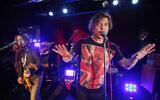 Aleksandr 'Shura' Uman, left, and Egor Bortnik perform during the Bi-2 rock band concert in Moscow, Russia, December 1, 2011. (AP Photo/Pavel Golovkin, File)