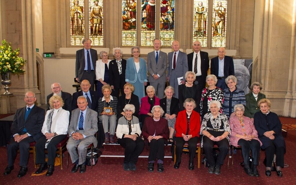 Evacuees rescued as children by the Kindertransport set up by Sir Nicholas Winton pose for a photo at his memorial service, in central London, May 19, 2016. (Dominic Lipinski/Pool Photo via AP)