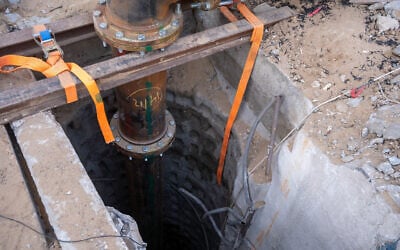Illustrative: A pipe pumping water into a Hamas tunnel is seen near Palestine Square in Gaza City’s Rimal neighborhood, December 19, 2023. (Emanuel Fabian/Times of Israel)