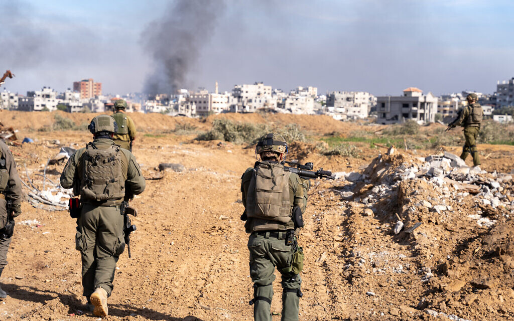 IDF soldiers are seen in central Gaza's Bureij, January 8, 2024. (Emanuel Fabian/Times of Israel)