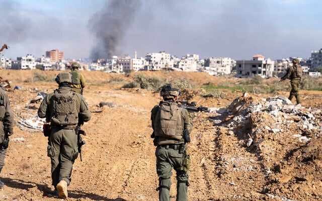 IDF soldiers are seen in central Gaza's Bureij, January 8, 2024. (Emanuel Fabian/Times of Israel)