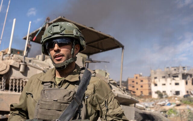 Lt. Col. Daniel Ella, the commander of the 401st Armored Brigade’s 52nd Battalion, speaks to reporters in Gaza City's Tuffah neighborhood, January 21, 2024. (Emanuel Fabian/ Times of Israel) Lt. Col. Daniel Ella, the commander of the 401st Armored Brigade’s 52nd Battalion, speaks to reporters in Gaza City's Tuffah neighborhood, January 21, 2024. (Emanuel Fabian/ Times of Israel)