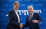 Yesh Atid party leader Yair Lapid (right) welcomes Ram Ben Barak to the party, at a faction meeting in the Knesset, January 15, 2018. (Yonatan Sindel/Flash90)
