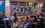 Israelis celebrating New Year's Eve in Tel Aviv, December 31, 2023. (Photo by Avshalom Sassoni/Flash90)