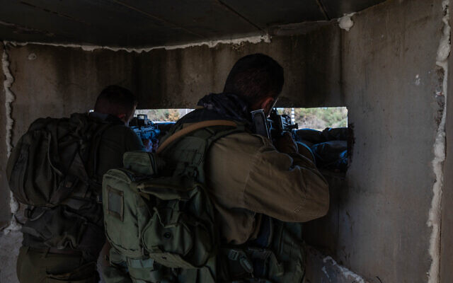 IDF soldiers guard at a temporary checkpoint on a road in northern Israel, near the border with Lebanon, January 6, 2024. (Ayal Margolin/Flash90) IDF soldiers guard at a temporary checkpoint on a road in northern Israel, near the border with Lebanon, January 6, 2024. (Ayal Margolin/Flash90)
