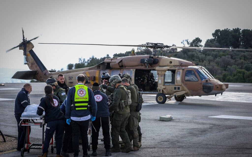 A wounded man from the scene of the anti-tank missile in Kfar Yuval, is brought to the Ziv Medical center in Tzfat, northern Israel, January 14, 2024. (David Cohen/Flash90)