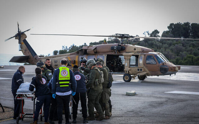 A wounded man from the scene of the anti-tank missile in Kfar Yuval, is brought to the Ziv Medical center in Tzfat, northern Israel, January 14, 2024. (David Cohen/Flash90)