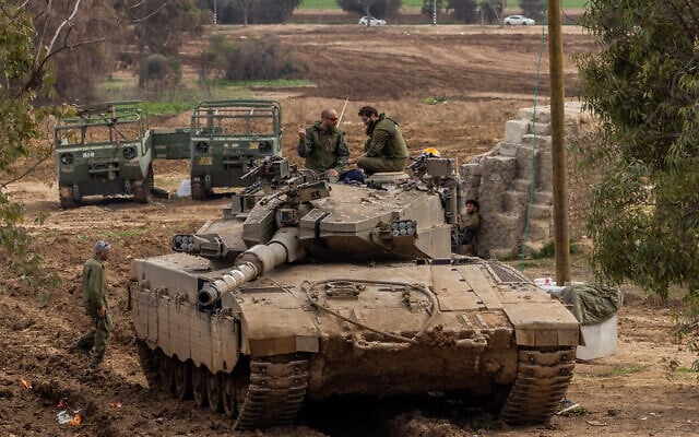 Soldiers seen at a staging area near the Gaza border, southern Israel, January 21, 2024 (Chaim Goldberg/Flash90)