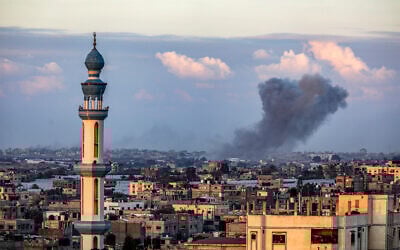 Smoke rises after apparent Israeli airstrikes in Khan Younis as seen from Rafah, in the southern Gaza Strip, January 24, 2024. (Abed Rahim Khatib/Flash90)