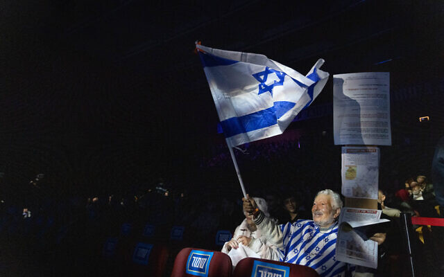 A participant at a conference calling to resettle the Gaza Strip at the International Convention Center in Jerusalem on January 28, 2024. (Chaim Goldberg/Flash90)
